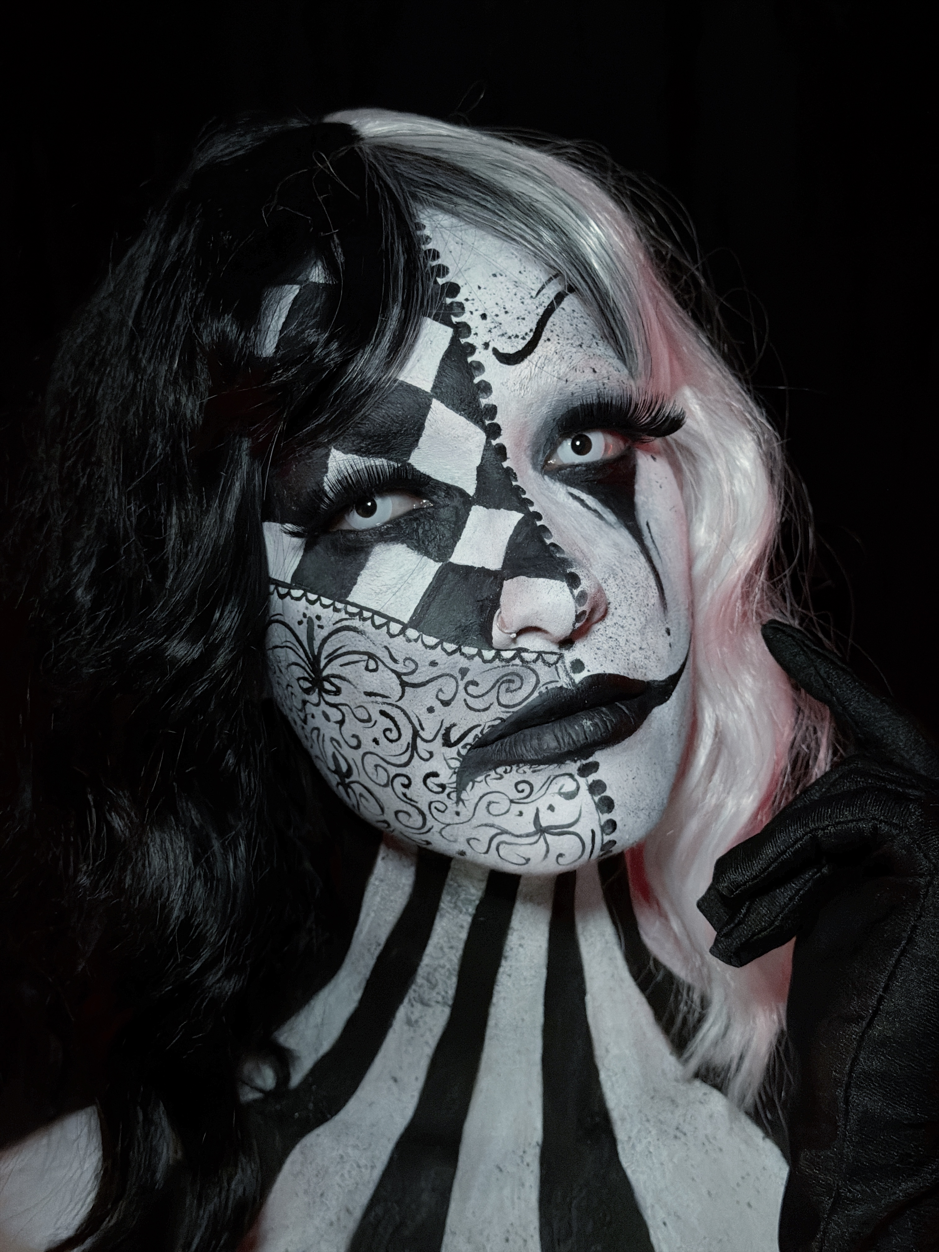 Black and white harlequin face art by Laura Gil Sánchez