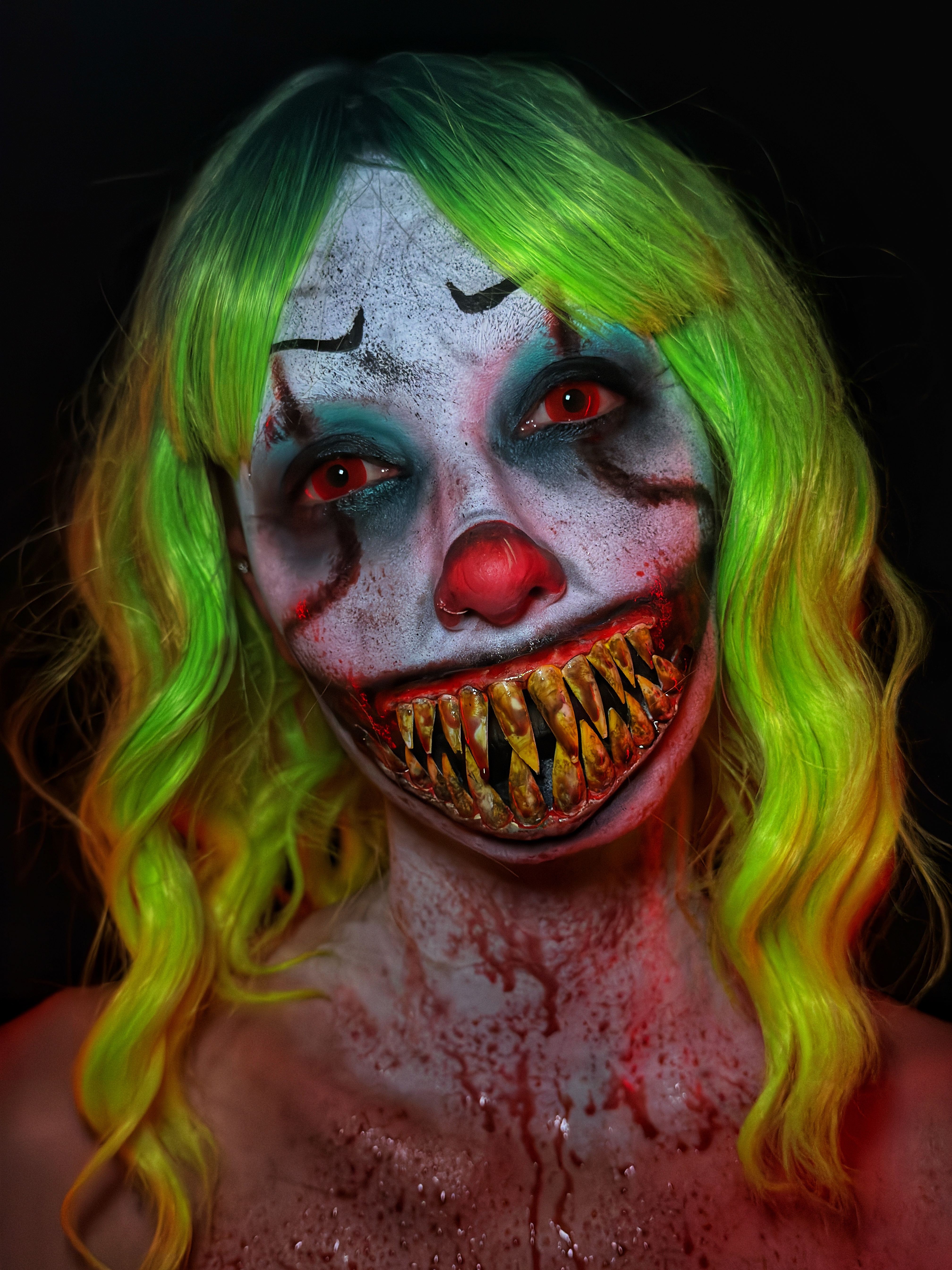 Horror clown special effects makeup with prosthetic teeth